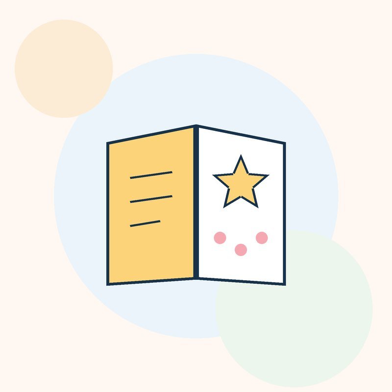 A folded card with a yellow star and pink dots on the front